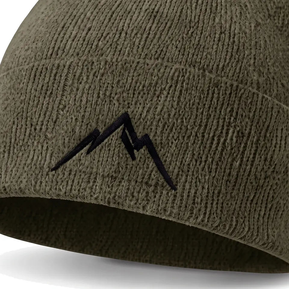 Col Rib beanie in Olive: close-up of the cuff embroidery