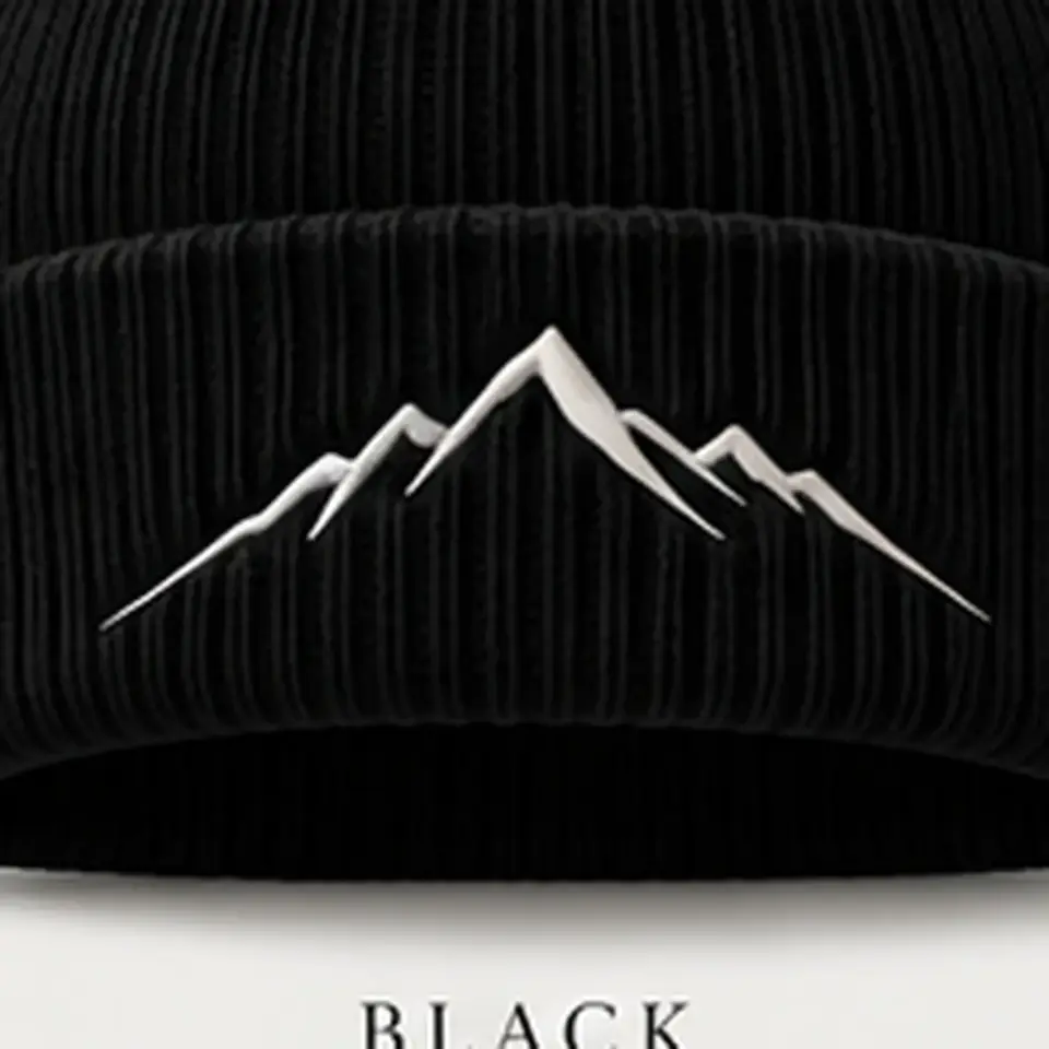Alpine beanie in Black: close-up of the cuff embroidery