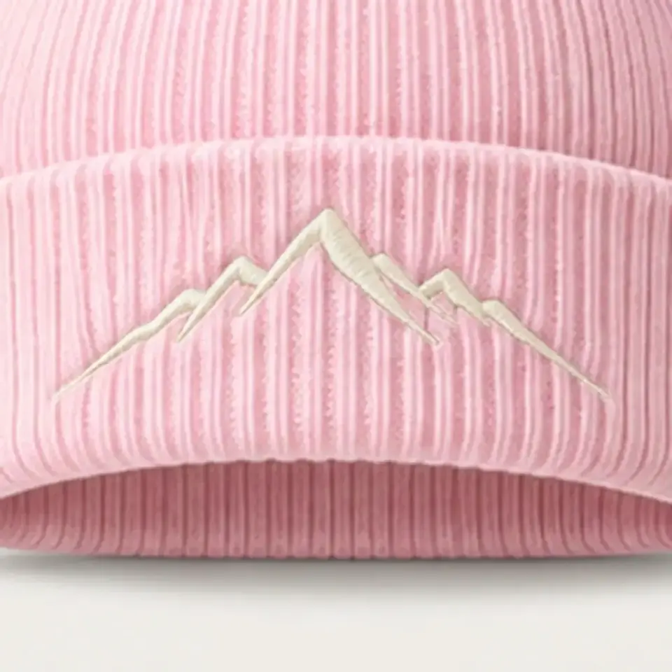 Alpine beanie in Blush Pink: close-up of the cuff embroidery