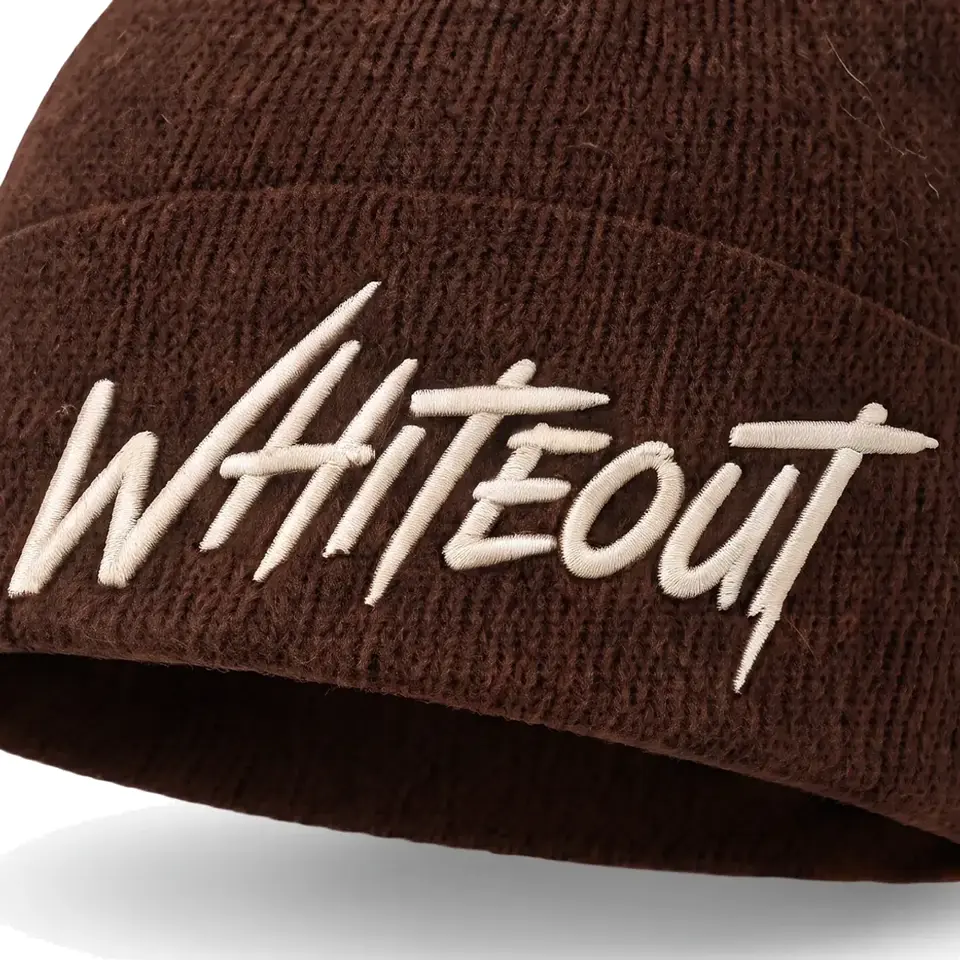 Chalet beanie in Chocolate: close-up of the cuff embroidery
