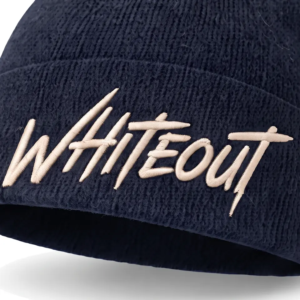 Chalet beanie in Navy: close-up of the cuff embroidery