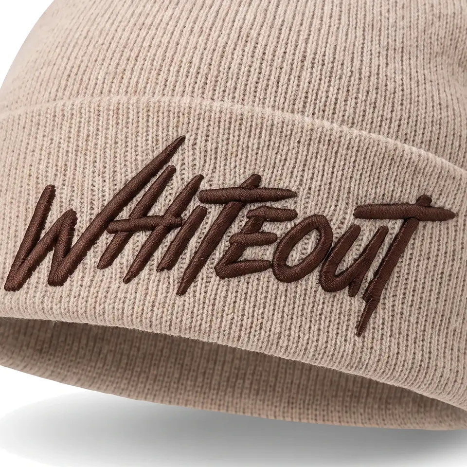 Chalet beanie in Stone: close-up of the cuff embroidery