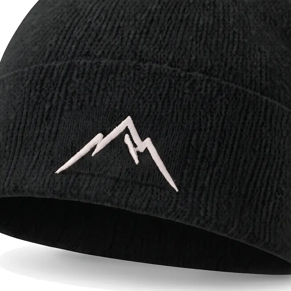 Atelier beanie in Black: close-up of the cuff embroidery
