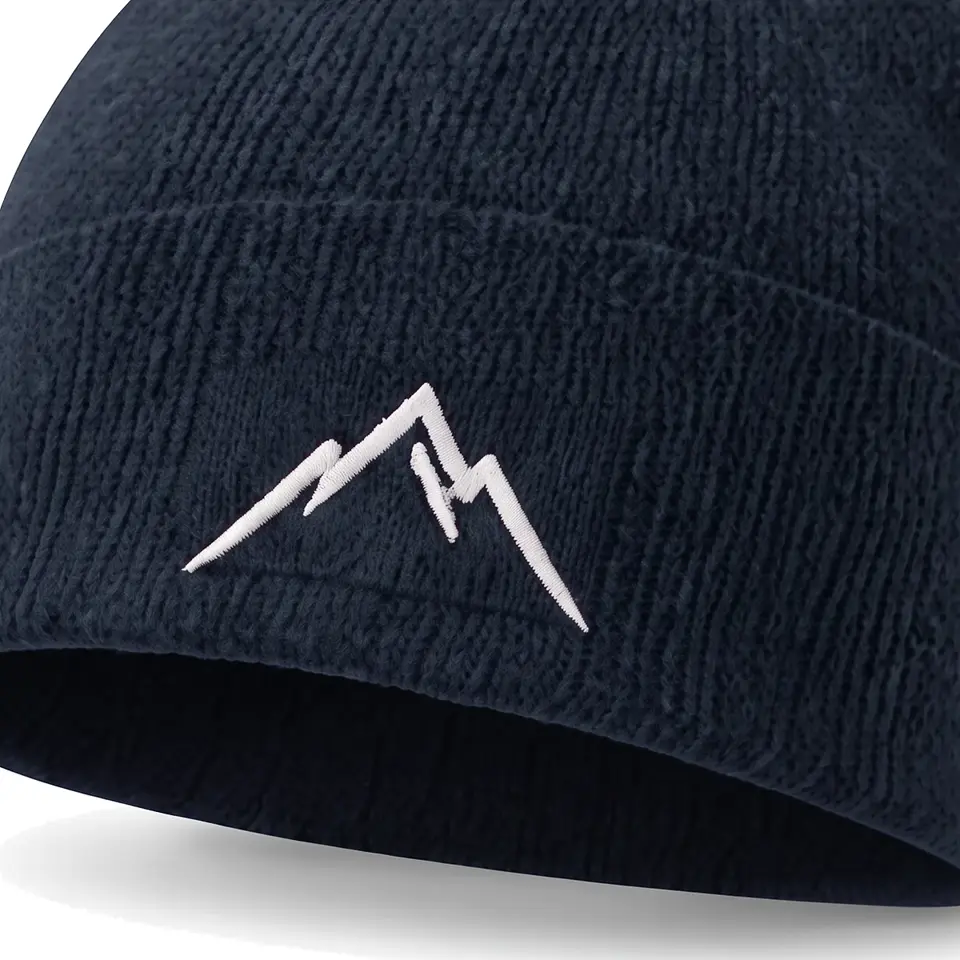 Atelier beanie in Navy: close-up of the cuff embroidery