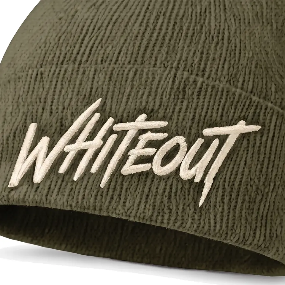 Chalet beanie in Olive: close-up of the cuff embroidery