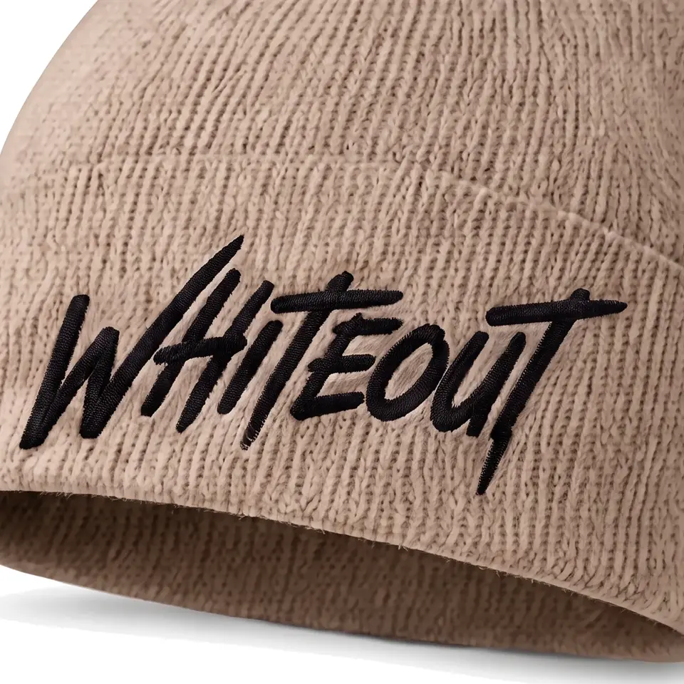 Chalet beanie in Taupe: close-up of the cuff embroidery