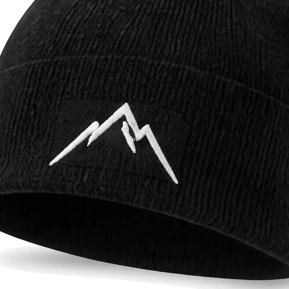 Col Rib beanie in Black: close-up of the cuff embroidery