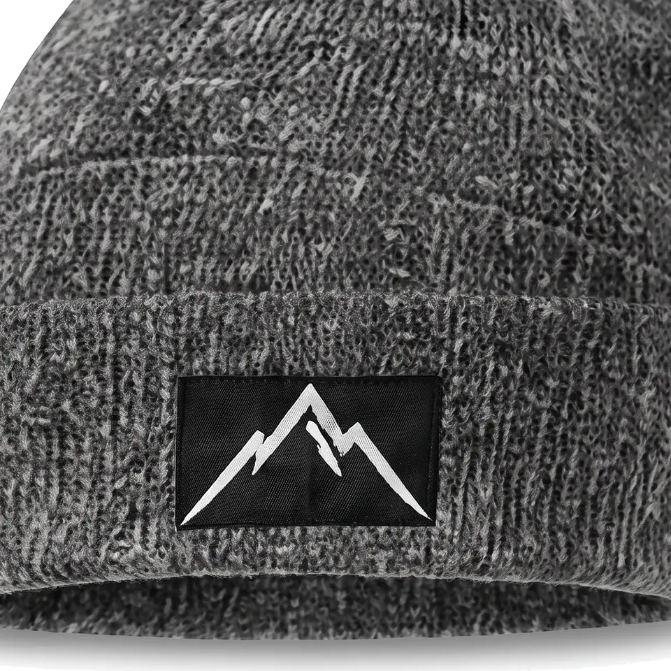 Crest beanie in Grey: close-up of the cuff patch
