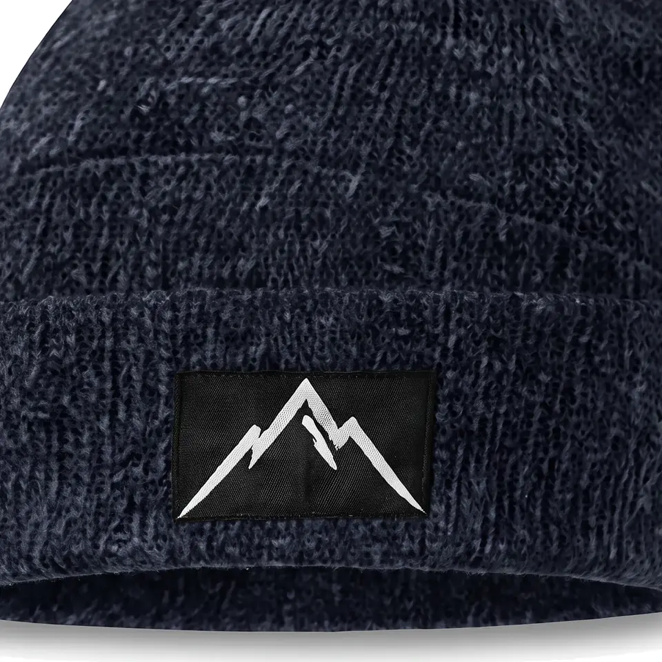 Crest beanie in Navy: close-up of the cuff patch