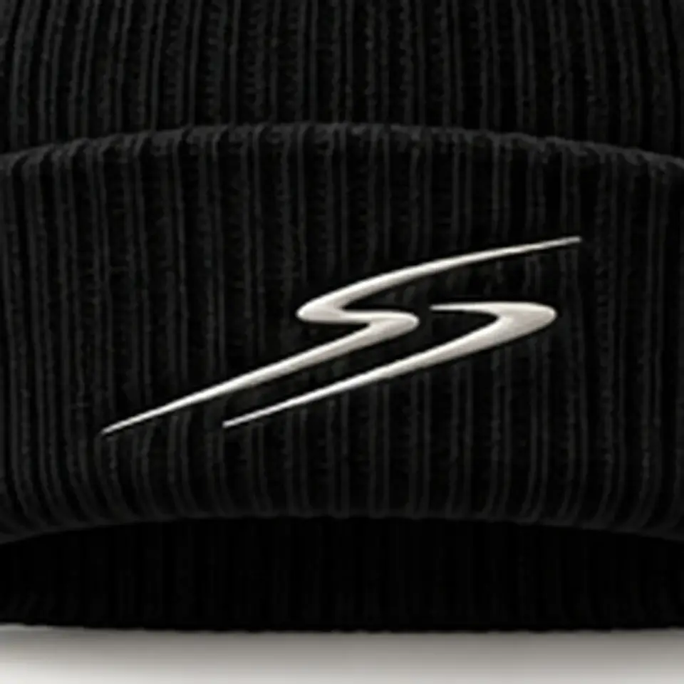 Drift beanie in Black: close-up of the cuff embroidery