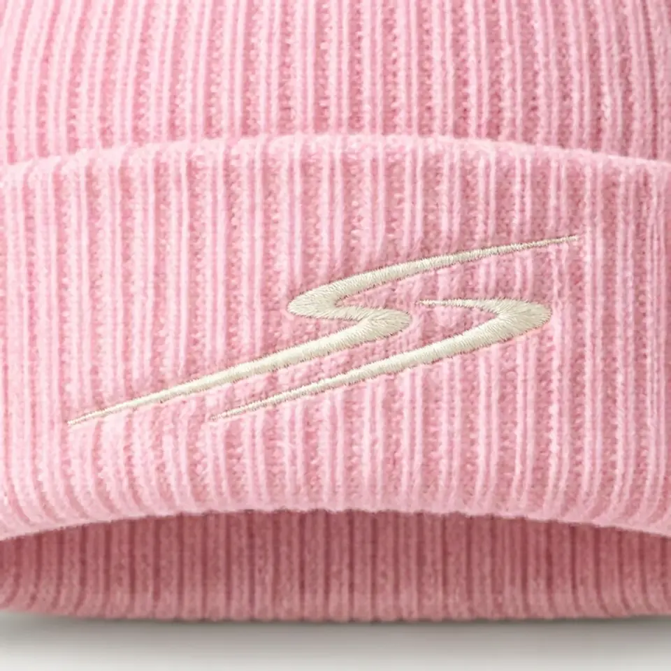 Drift beanie in Blush Pink: close-up of the cuff embroidery