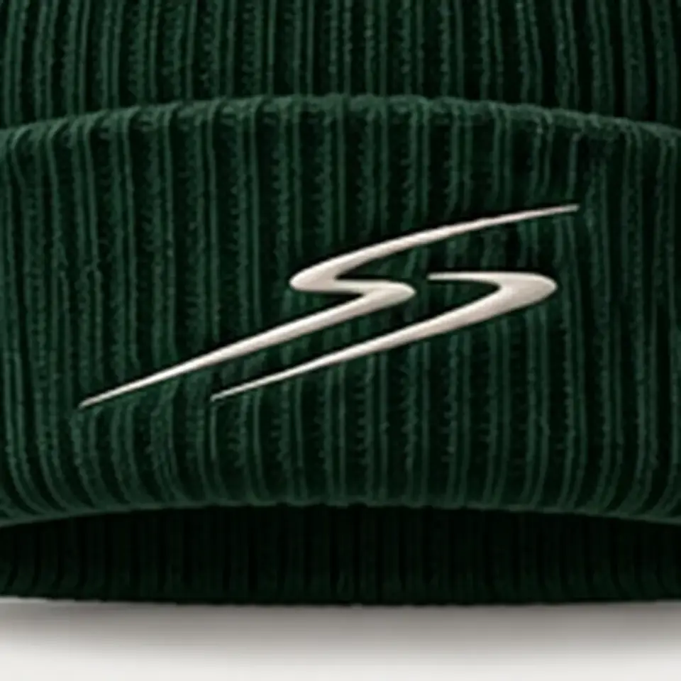Drift beanie in Forest: close-up of the cuff embroidery