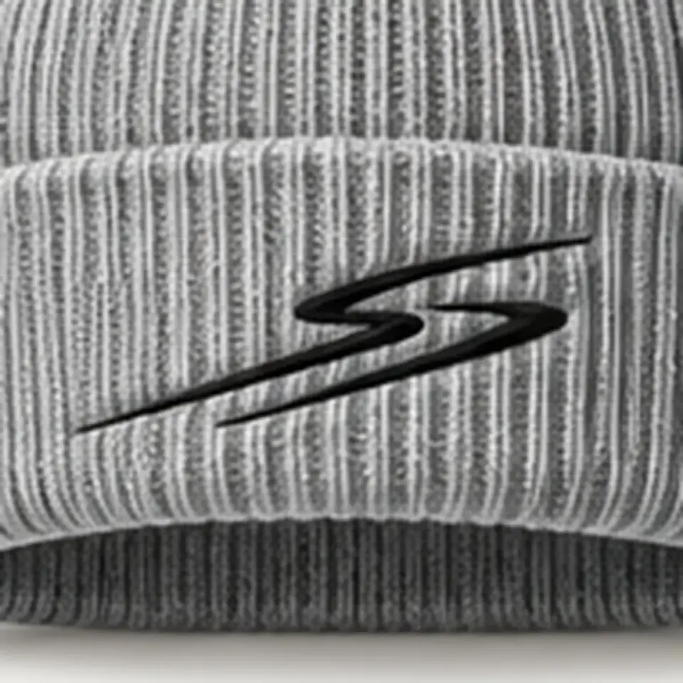 Drift beanie in Heather Grey: close-up of the cuff embroidery