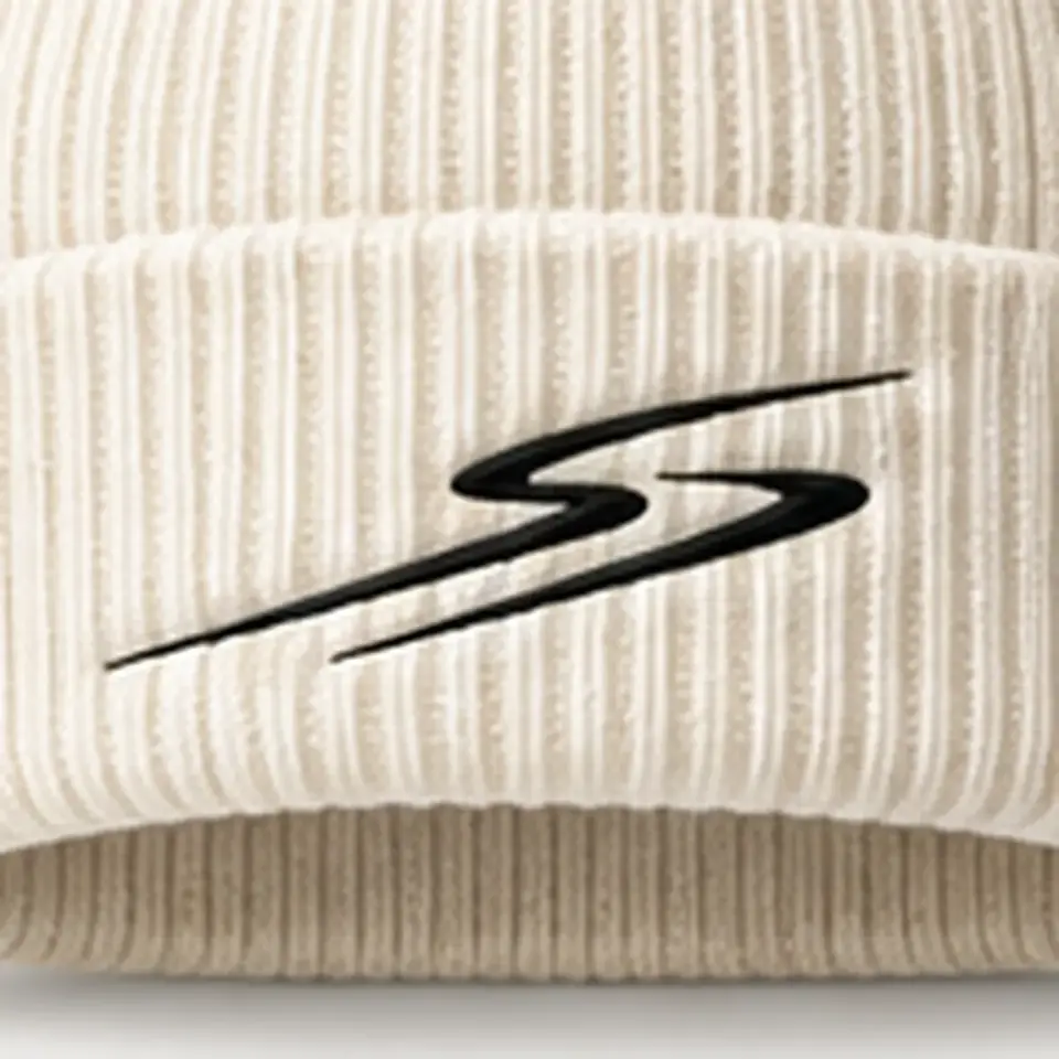 Drift beanie in Ivory: close-up of the cuff embroidery