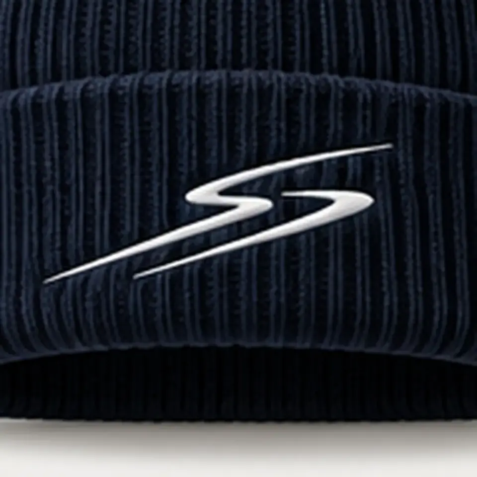 Drift beanie in Navy: close-up of the cuff embroidery