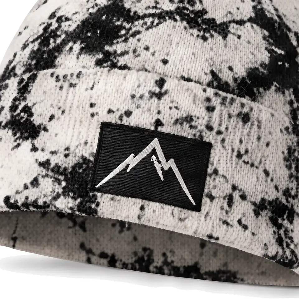 Haute Route beanie in Cream: close-up of the cuff patch
