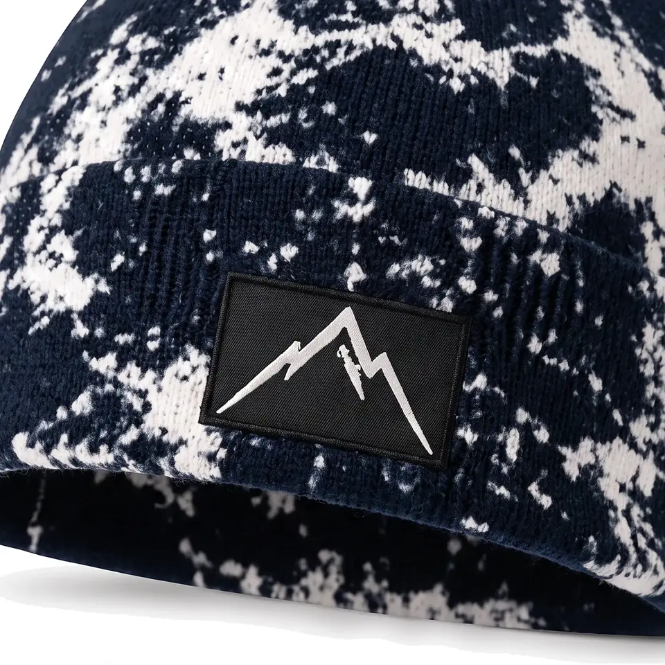 Haute Route beanie in Navy: close-up of the cuff patch