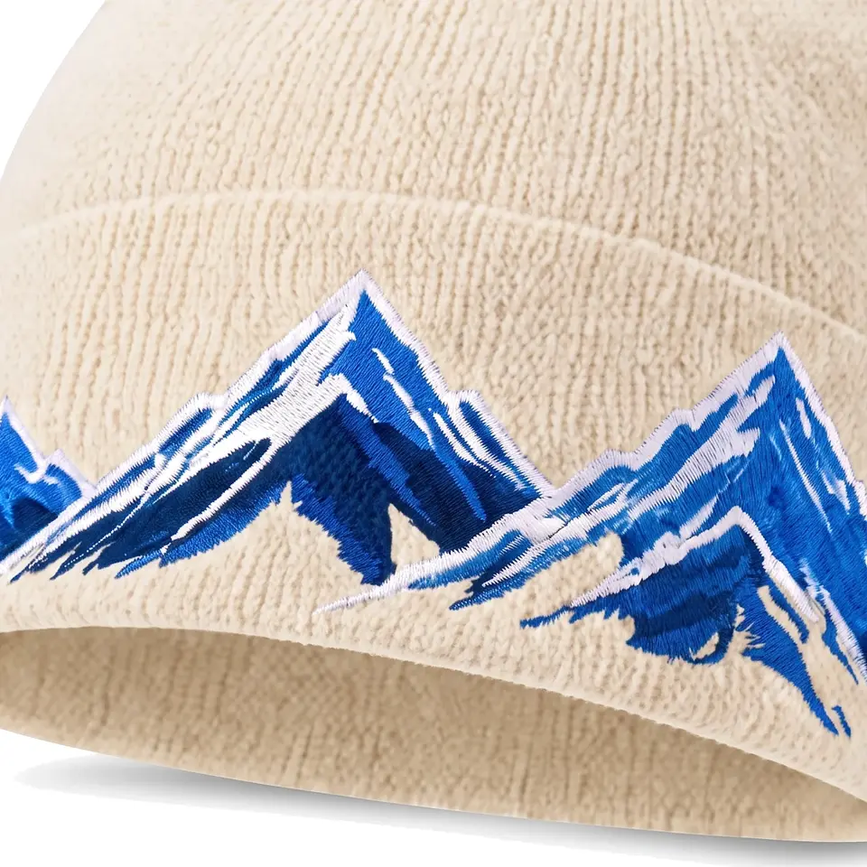 Windline beanie in Cream: close-up of the cuff embroidery