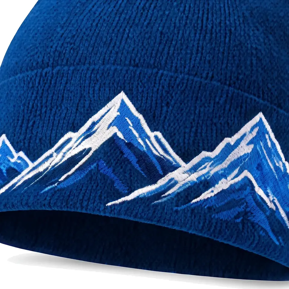 Windline beanie in Royal Blue: close-up of the cuff embroidery