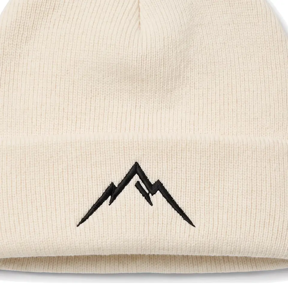 Lauber beanie in Ivory: close-up of the cuff embroidery