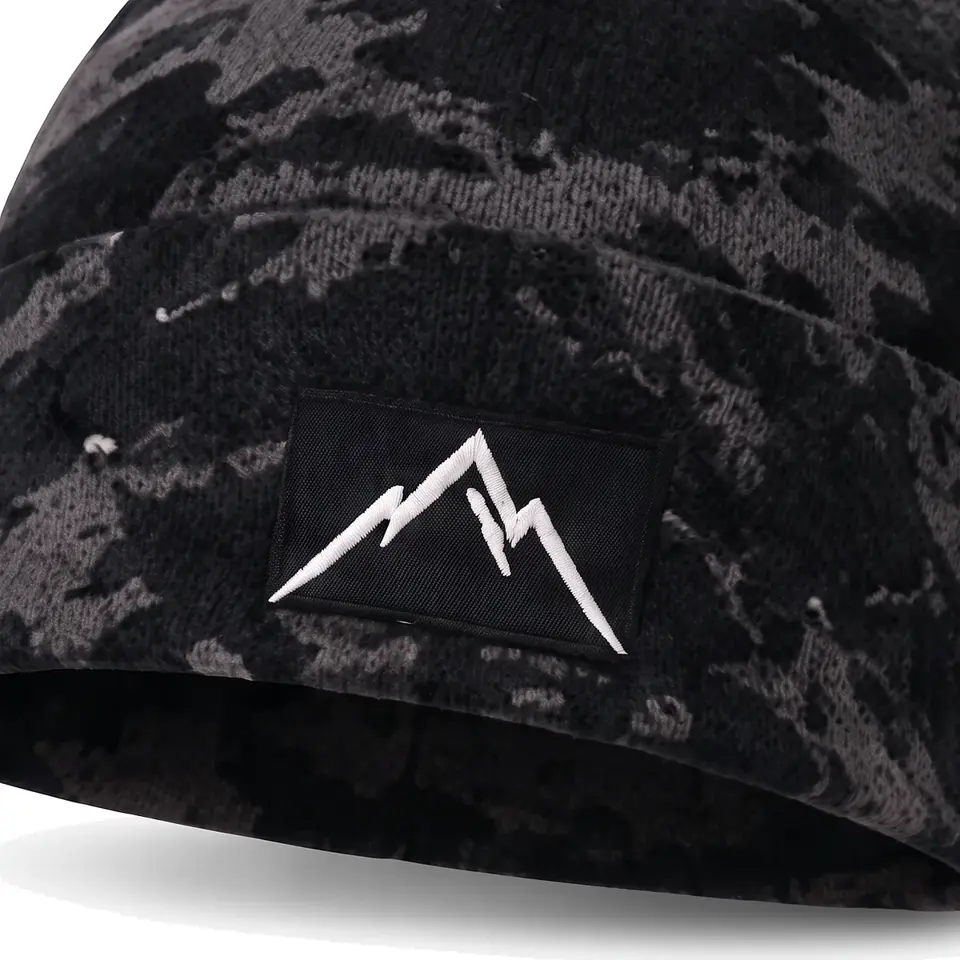 Refuge beanie in Black Camo: close-up of the cuff embroidery