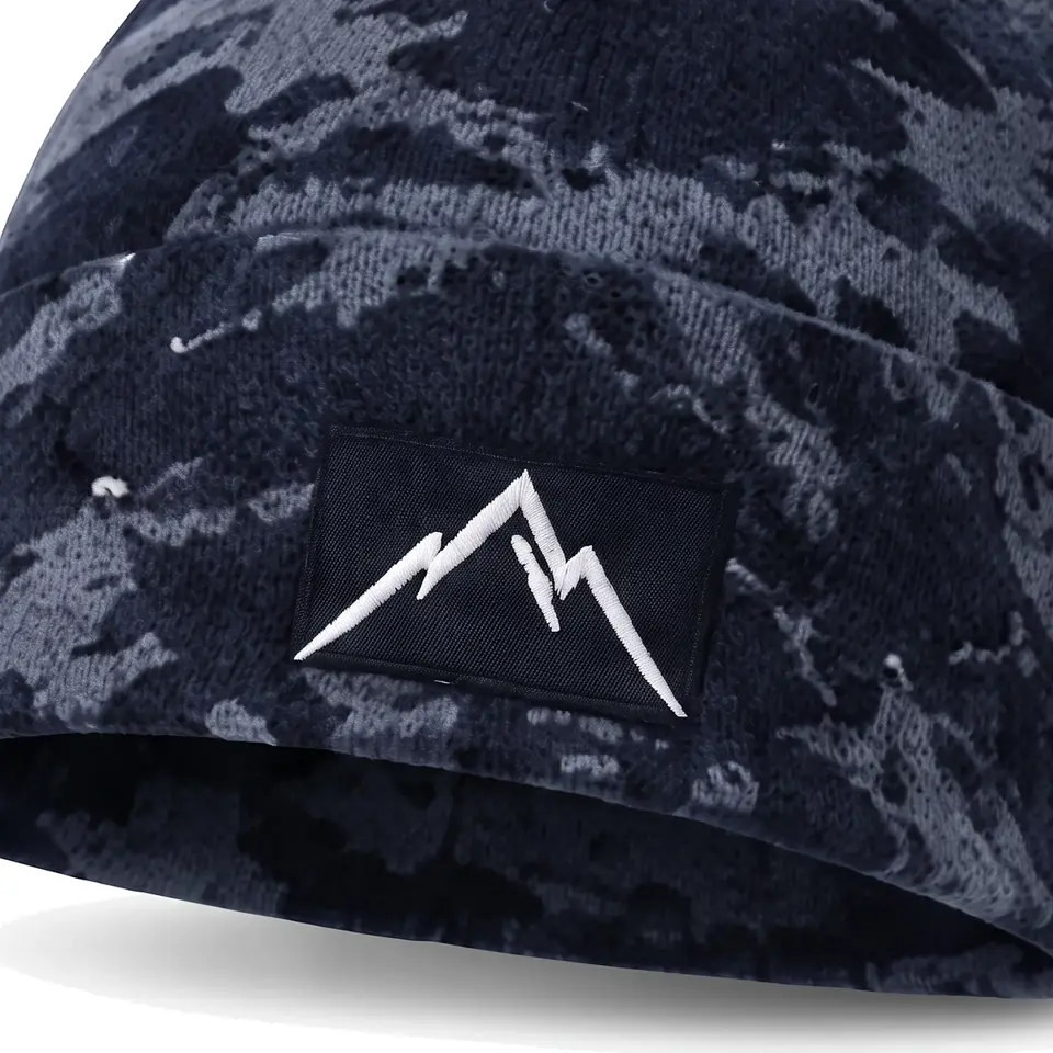 Refuge beanie in Navy Camo: close-up of the cuff embroidery