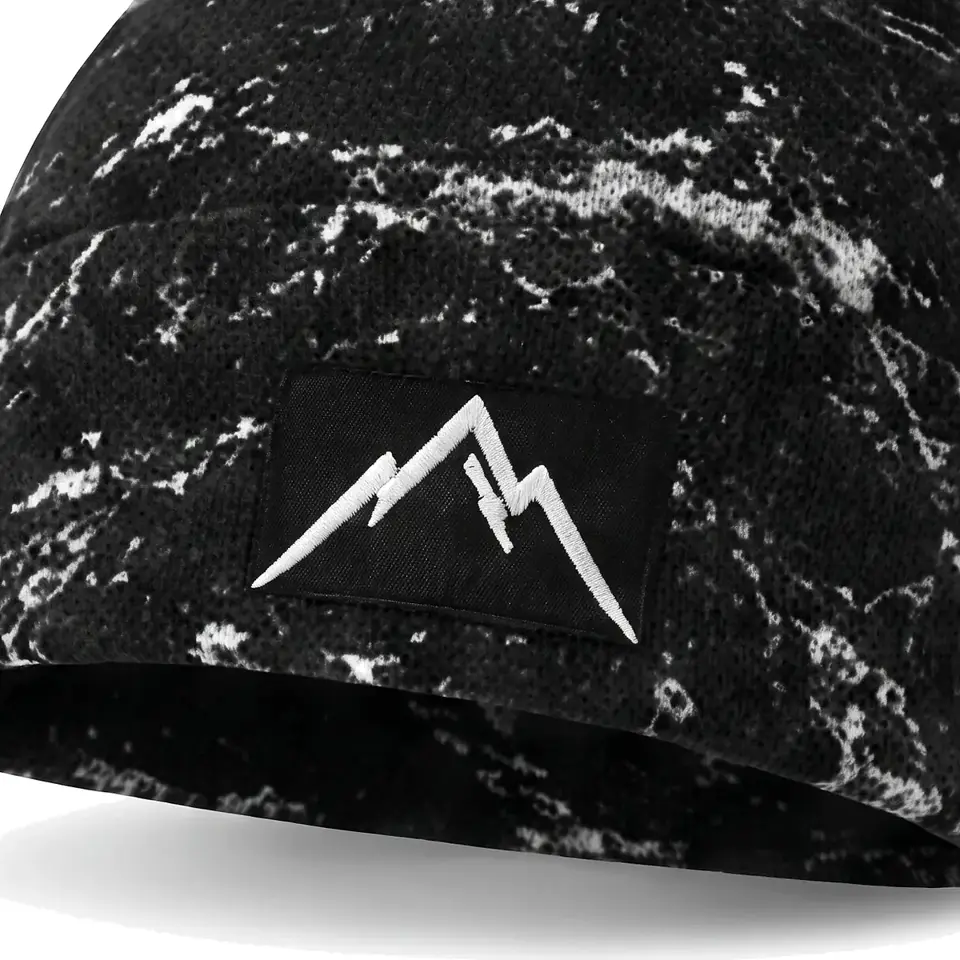 Refuge beanie in Black Veined Marble: close-up of the cuff embroidery