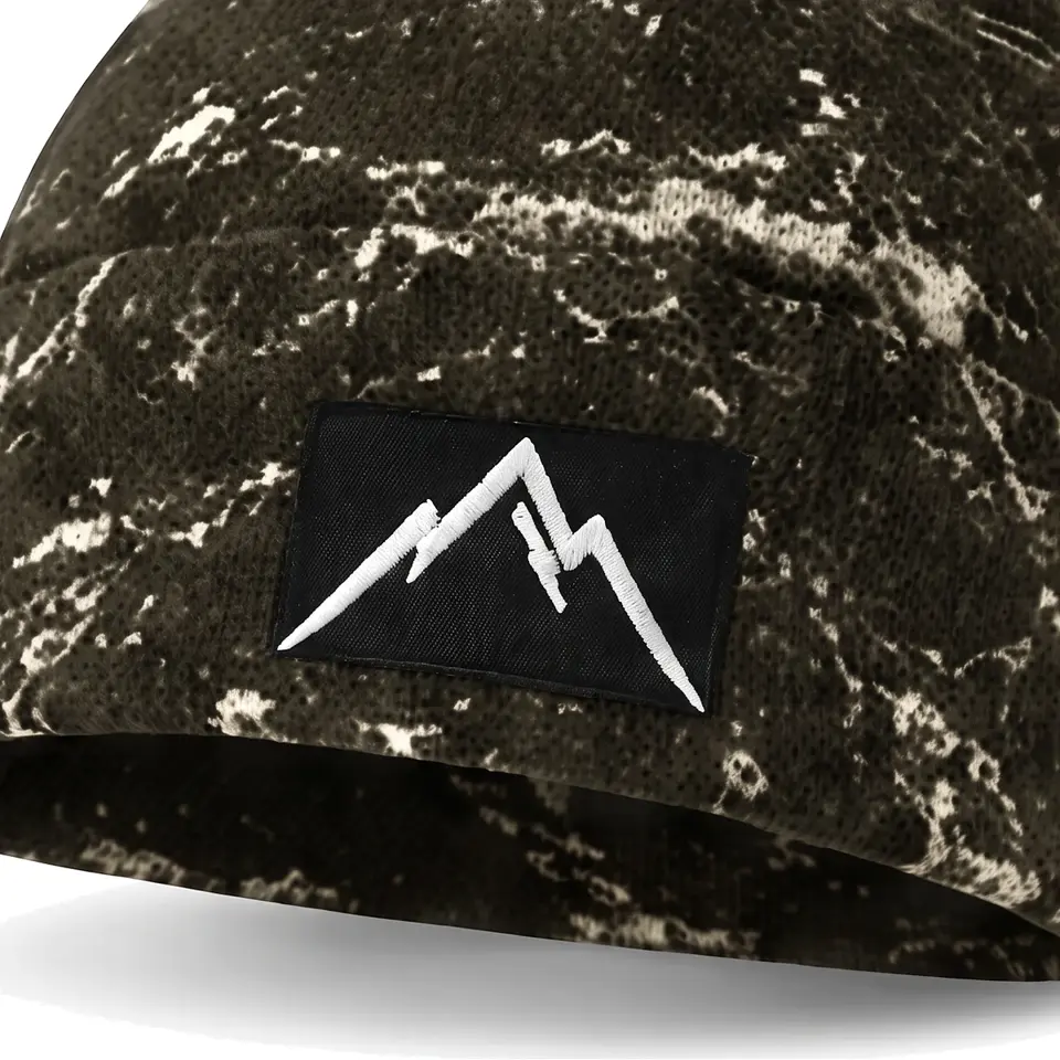 Refuge beanie in Olive Veined Marble: close-up of the cuff patch