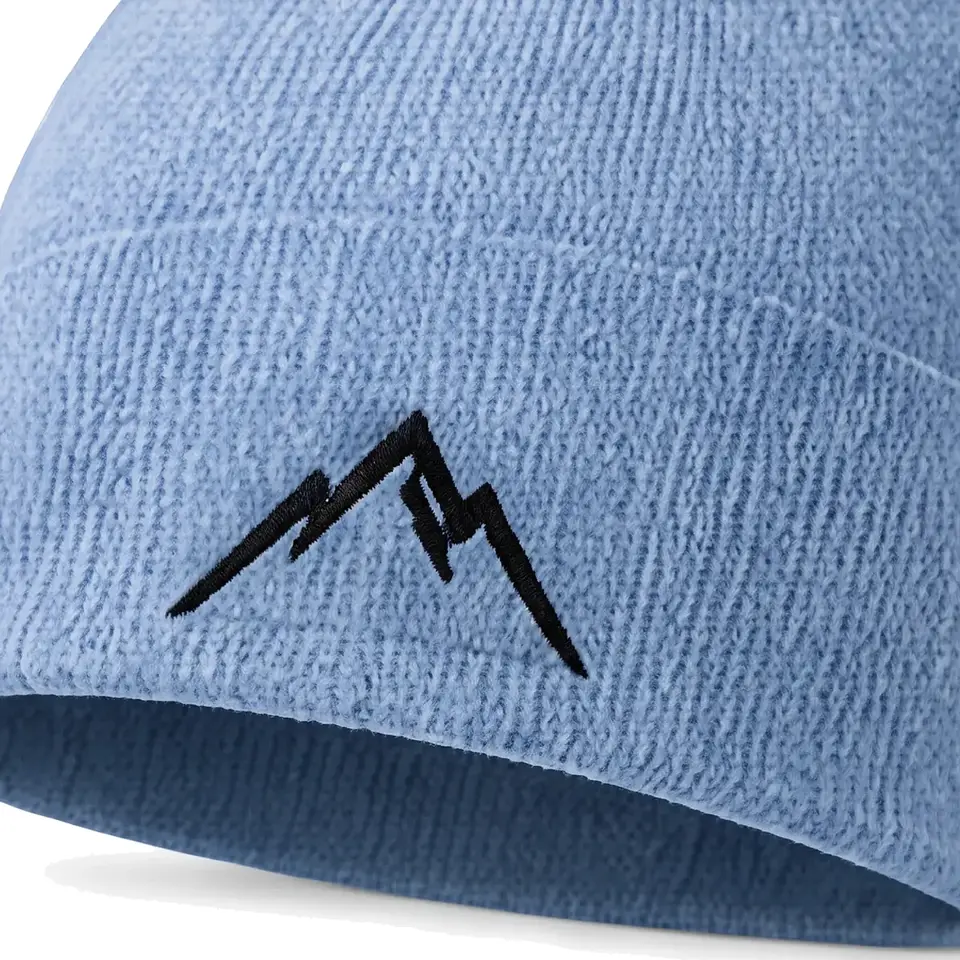 Atelier beanie in Ice Blue: close-up of the cuff embroidery