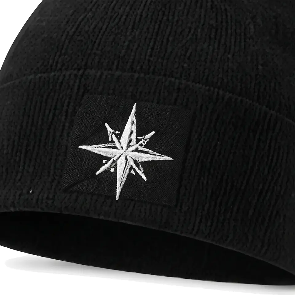 Summit beanie in Black: close-up of the cuff patch