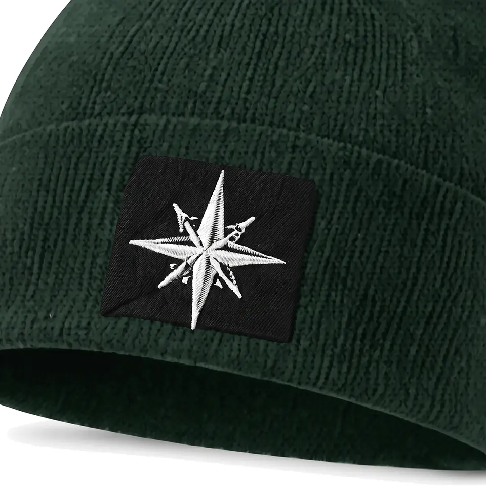 Summit beanie in Forest: close-up of the cuff patch
