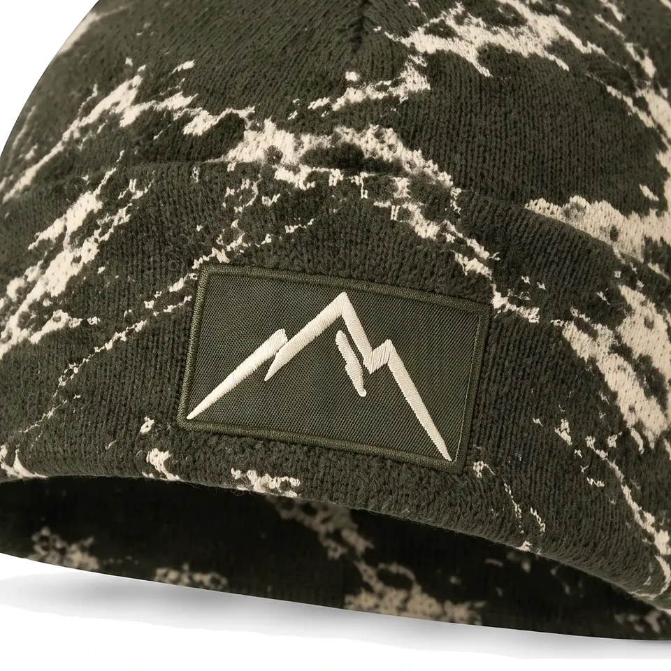 Refuge beanie in Olive Bold Marble: close-up of the cuff patch