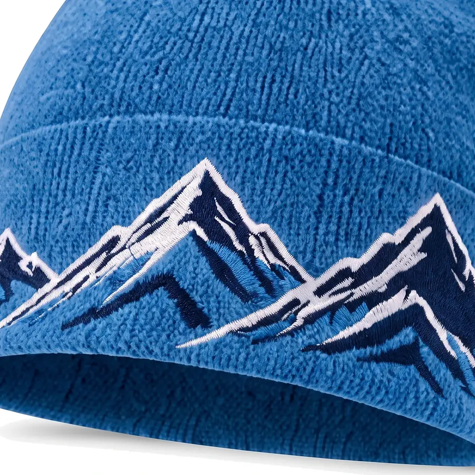 Windline beanie in Blue: close-up of the cuff embroidery