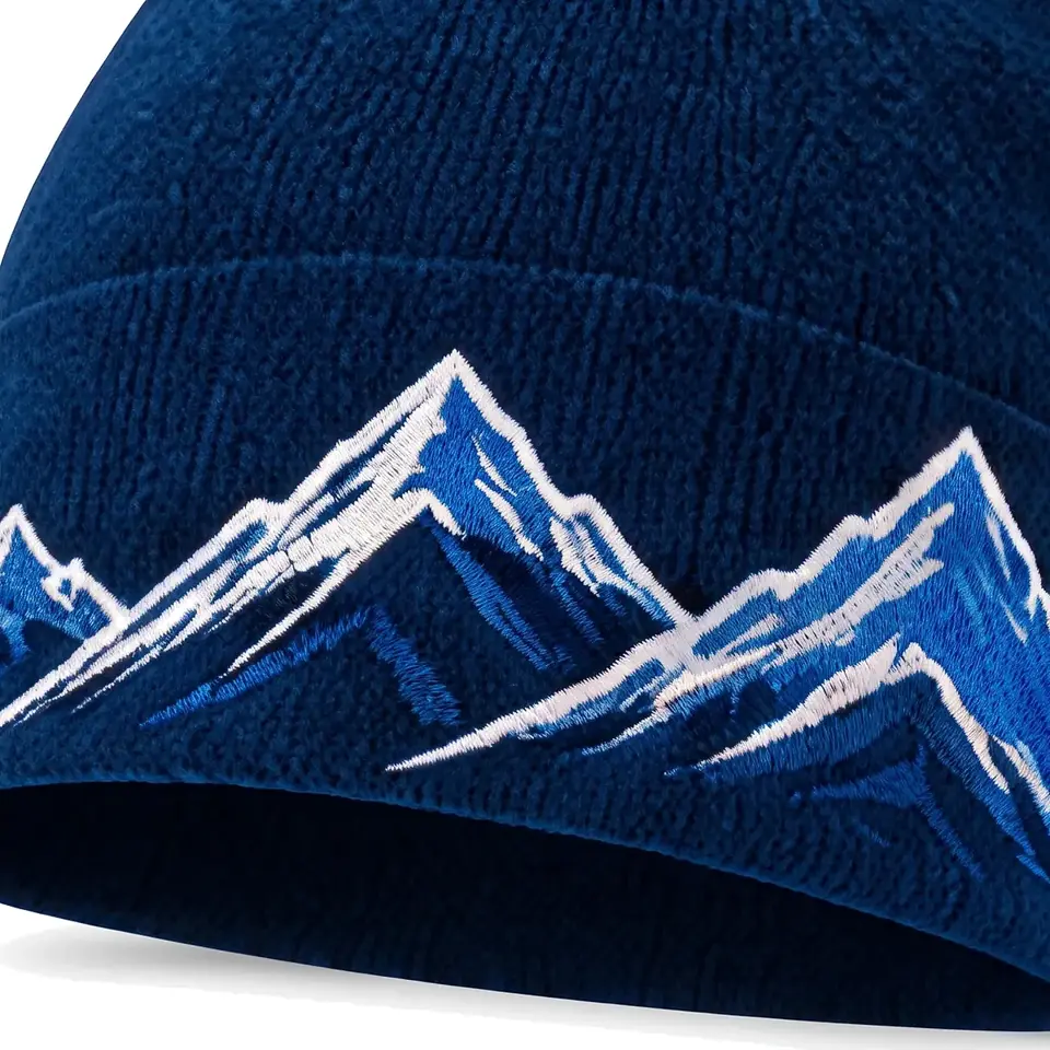 Windline beanie in Navy: close-up of the cuff embroidery