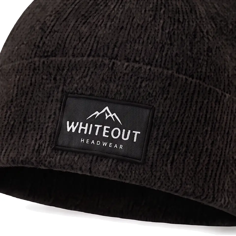 Zermatt beanie in Black: close-up of the cuff label