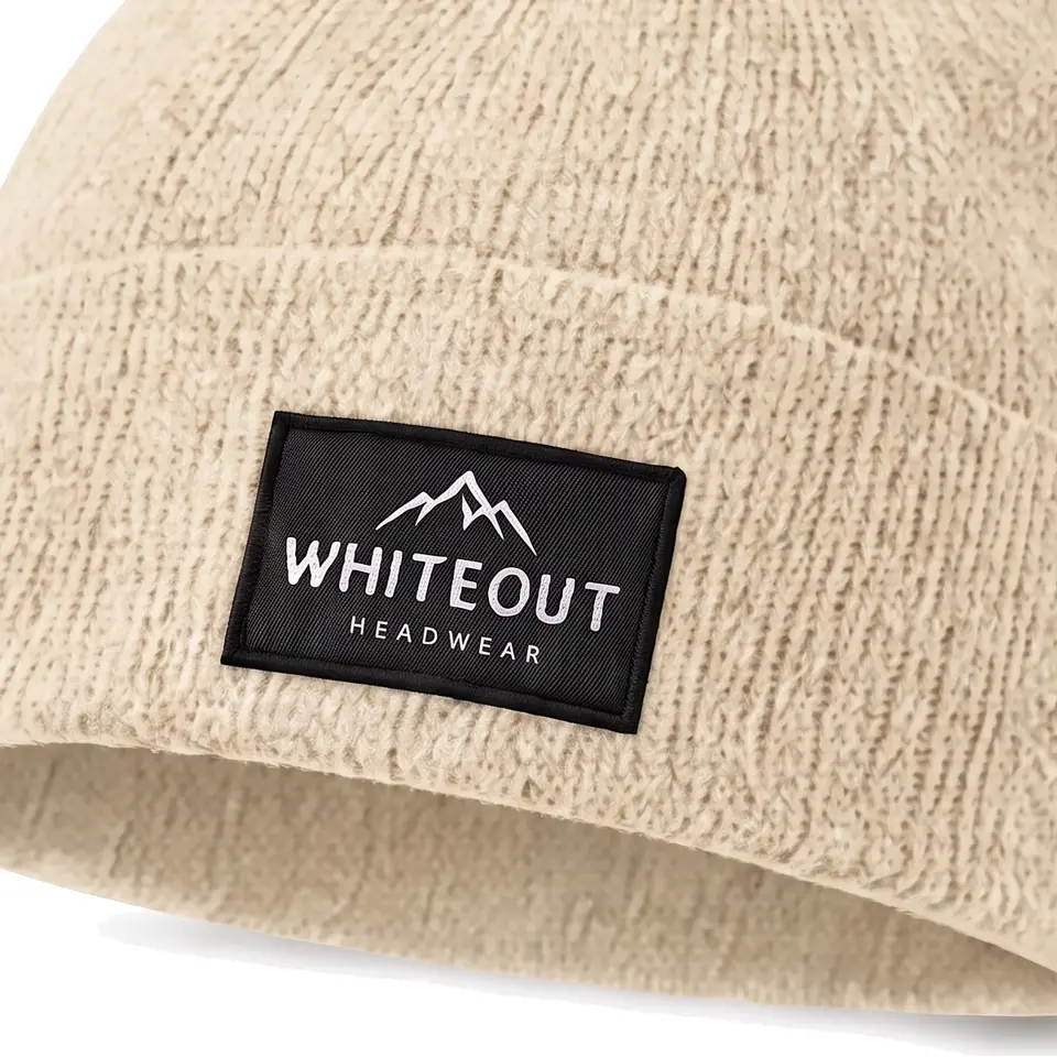 Zermatt beanie in Cream: close-up of the cuff label