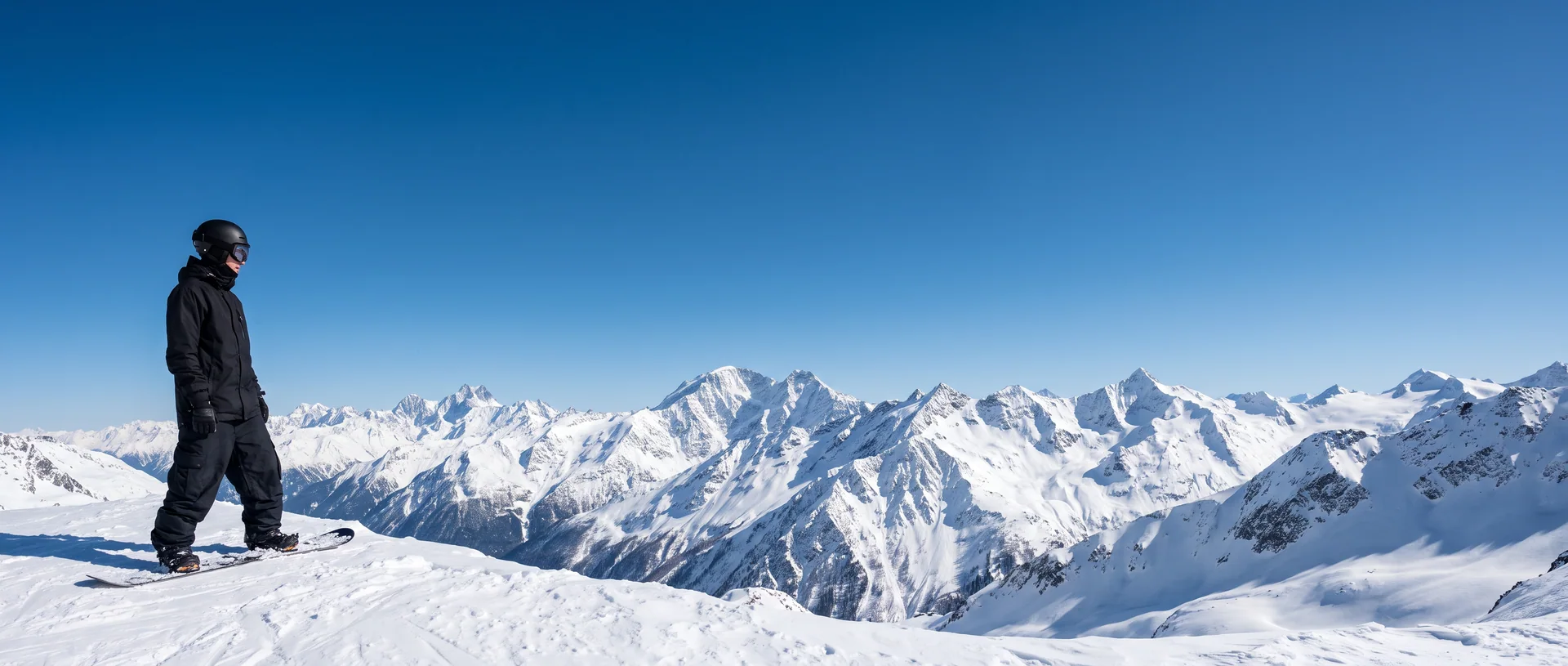 Snowboarder on a snowy alpine ridge, Snow Pants collection