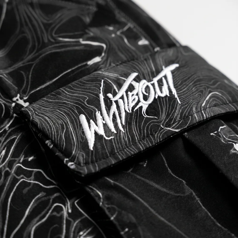 Ridgeline Topo: logo and embroidery close-up, concept render
