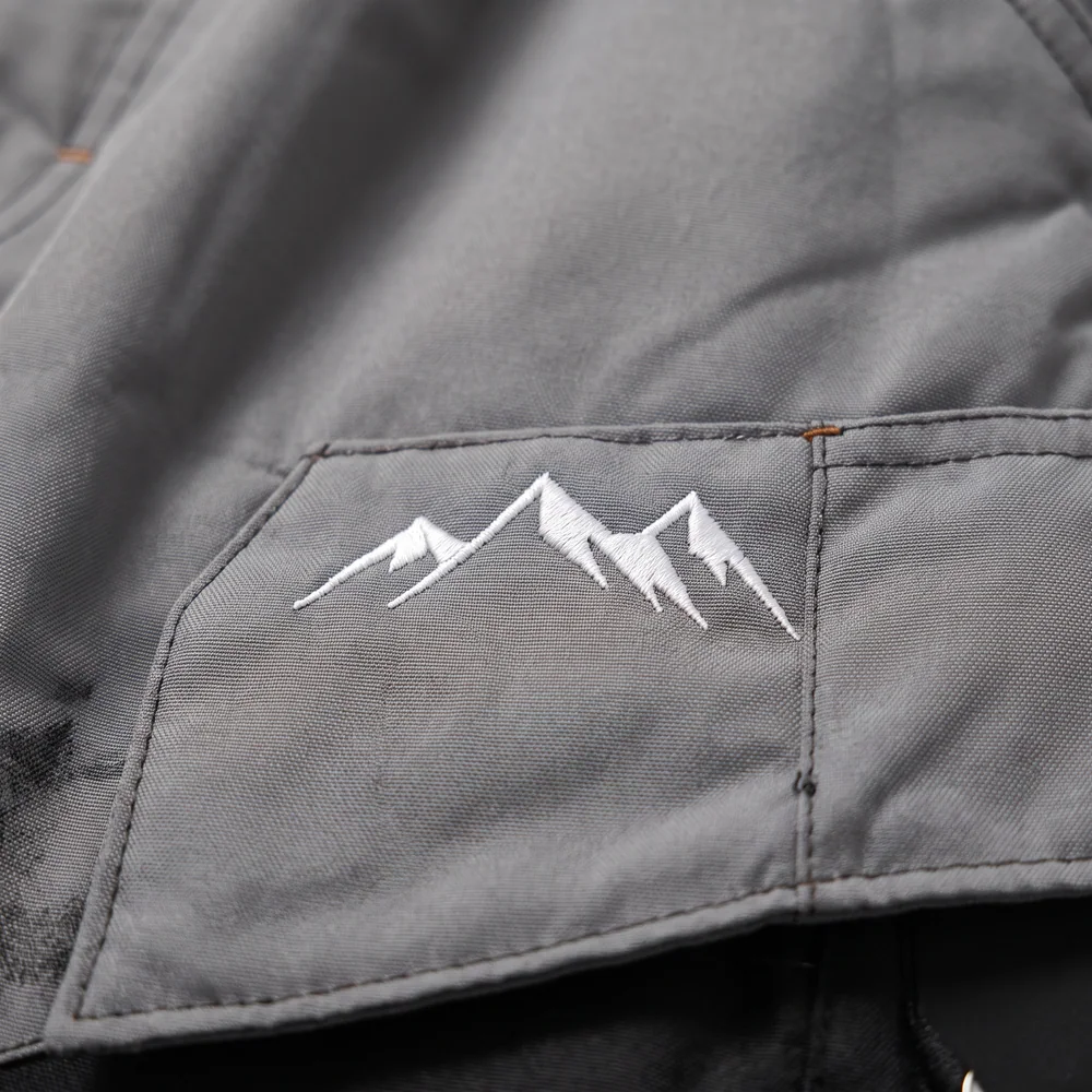 Shadow Grey: logo and embroidery close-up, concept render